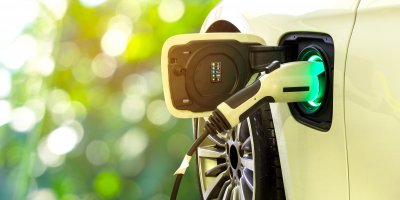 Electric Vehicle Deployment: Parking Matters